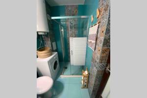 A bathroom at Seaview dreamy apartment with a pool and garden