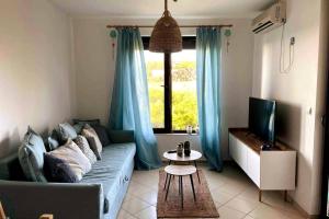 A seating area at Seaview dreamy apartment with a pool and garden