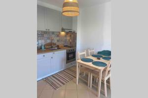 A kitchen or kitchenette at Seaview dreamy apartment with a pool and garden
