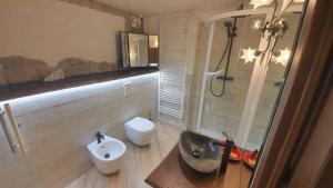 a bathroom with a sink and a toilet at B&B Chalet in Abetone