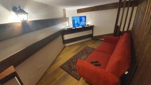TV a/nebo společenská místnost v ubytování B&B Chalet