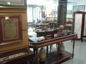 a museum with a model of a boat on display at Hostal Vila del Mar in Lloret de Mar