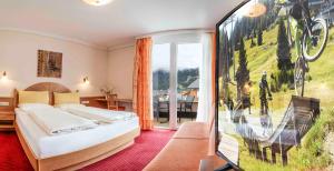 Postel nebo postele na pokoji v ubytování Hotel Montana