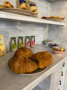 two loaves of bread on a shelf in a bakery at Sperlonga Paradise Suites 500m dal mare in estate Servizio navetta per Sperlonga centro in Sperlonga