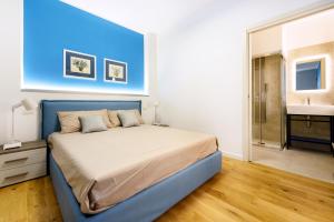Una cama o camas en una habitación de Appartamenti fronte mare Otranto