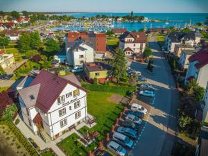 an aerial view of a small town with a harbor at Konik Morski in Jastarnia