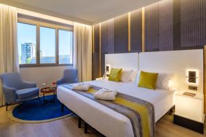 Postel nebo postele na pokoji v ubytování Savhotel Fiera Bologna