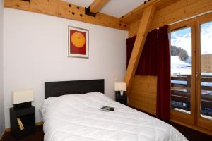 Posteľ alebo postele v izbe v ubytovaní Résidence Odalys Le Pelvoux