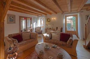 a living room with two couches and a coffee table at 4Bed3Bath 1736 Farmhouse Barn Conversion-Hearth in Sainte-Soline