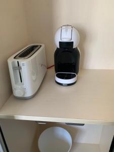 a coffee maker and a toaster sitting on a counter at Habitaciones tía Ela in Yaiza