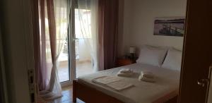 Ένα ή περισσότερα κρεβάτια σε δωμάτιο στο The Pearl