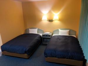Postel nebo postele na pokoji v ubytování Seagrande Shimizu Station Hotel + 34 fotografií