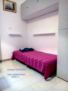 A bed or beds in a room at A un Passo dai Sassi