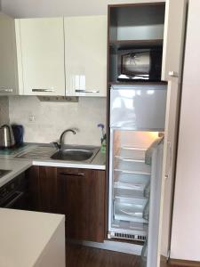 A kitchen or kitchenette at SIRENA Sea view apartments