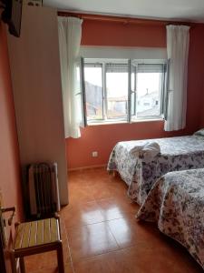 Łóżko lub łóżka w pokoju w obiekcie O Encontro