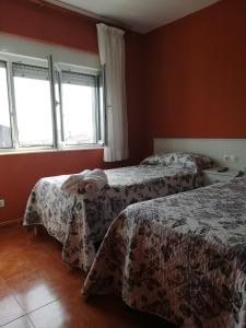 Łóżko lub łóżka w pokoju w obiekcie O Encontro