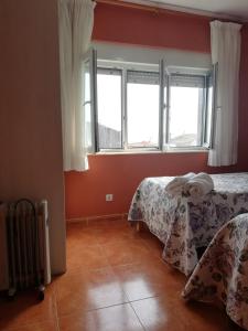 Łóżko lub łóżka w pokoju w obiekcie O Encontro