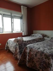 Łóżko lub łóżka w pokoju w obiekcie O Encontro