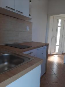 Kuchyň nebo kuchyňský kout v ubytování Apartments Čobanov