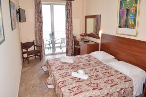 Postel nebo postele na pokoji v ubytování Sofia Hotel