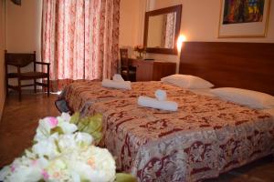 Postel nebo postele na pokoji v ubytování Sofia Hotel