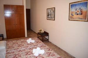 Postel nebo postele na pokoji v ubytování Sofia Hotel