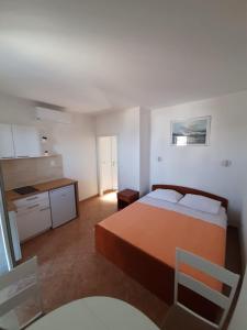 Postel nebo postele na pokoji v ubytování Apartments Čobanov