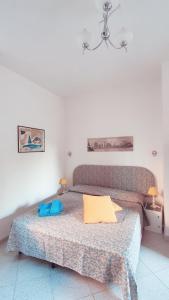 Ένα ή περισσότερα κρεβάτια σε δωμάτιο στο Villa Raffaela