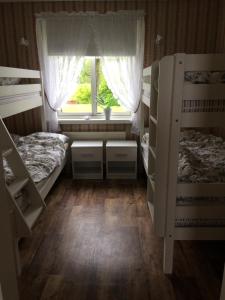 Voodi või voodid majutusasutuse Inga-Majs stuga toas