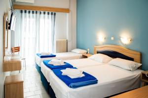 מיטה או מיטות בחדר ב-Hôtel Argo