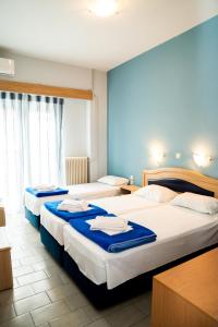 Posteľ alebo postele v izbe v ubytovaní Hôtel Argo