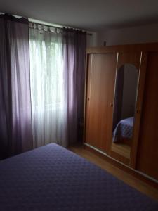 Postel nebo postele na pokoji v ubytování Apartments Makaus