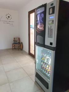 a refrigerator with its door open in a room at Chalet del Mare in Porto Cesareo
