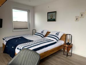 Ένα ή περισσότερα κρεβάτια σε δωμάτιο στο Weser Nah