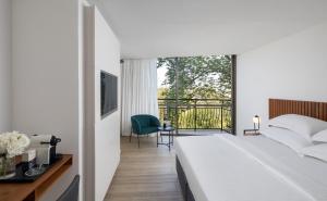 Postel nebo postele na pokoji v ubytování Hacienda Forest View Hotel
