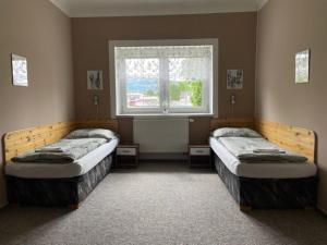 Postel nebo postele na pokoji v ubytování Penzion Jeseník