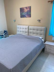 Кровать или кровати в номере Samothraki Akrogiali Rooms