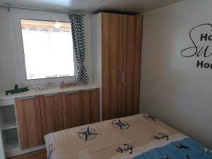 Posteľ alebo postele v izbe v ubytovaní SweetHome
