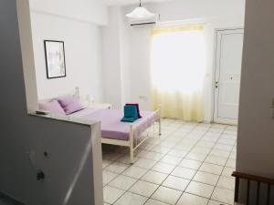 A bed or beds in a room at Korona beach apartments III