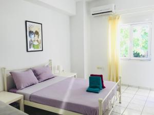 A bed or beds in a room at Korona beach apartments III