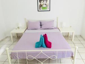 A bed or beds in a room at Korona beach apartments III