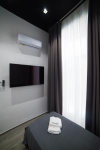Televízia a/alebo spoločenská miestnosť v ubytovaní Casa Felix