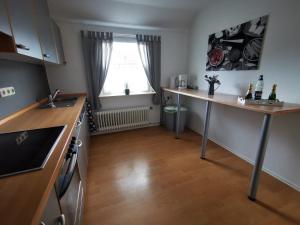 a kitchen with a sink and a counter top at Ferienwohnung Brunschön in Bruchhausen-Vilsen