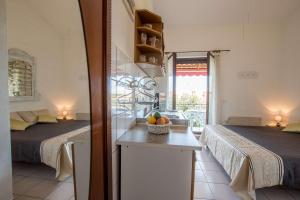 Postel nebo postele na pokoji v ubytování Apartmani Mirjana Umag