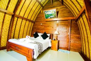 Postel nebo postele na pokoji v ubytování Pondok Bali Cottage