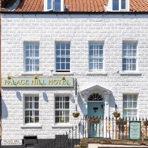 a white building with a sign that reads palace hill hotel at Palace Hill Hotel in Scarborough