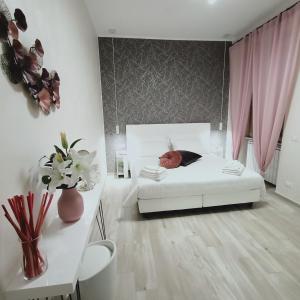 เตียงในห้องที่ Come a Casa Pretty Apartment