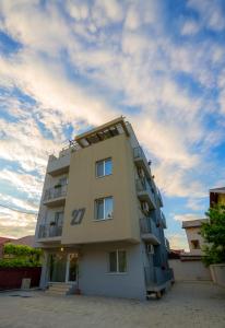 a tall building with the number on it at Vila 27 in Eforie Nord