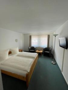 Postel nebo postele na pokoji v ubytování Hotel Garni „zum Bären“