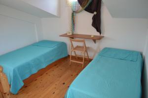 Ένα ή περισσότερα κρεβάτια σε δωμάτιο στο Serenity House Aigio Dimitropoulos
